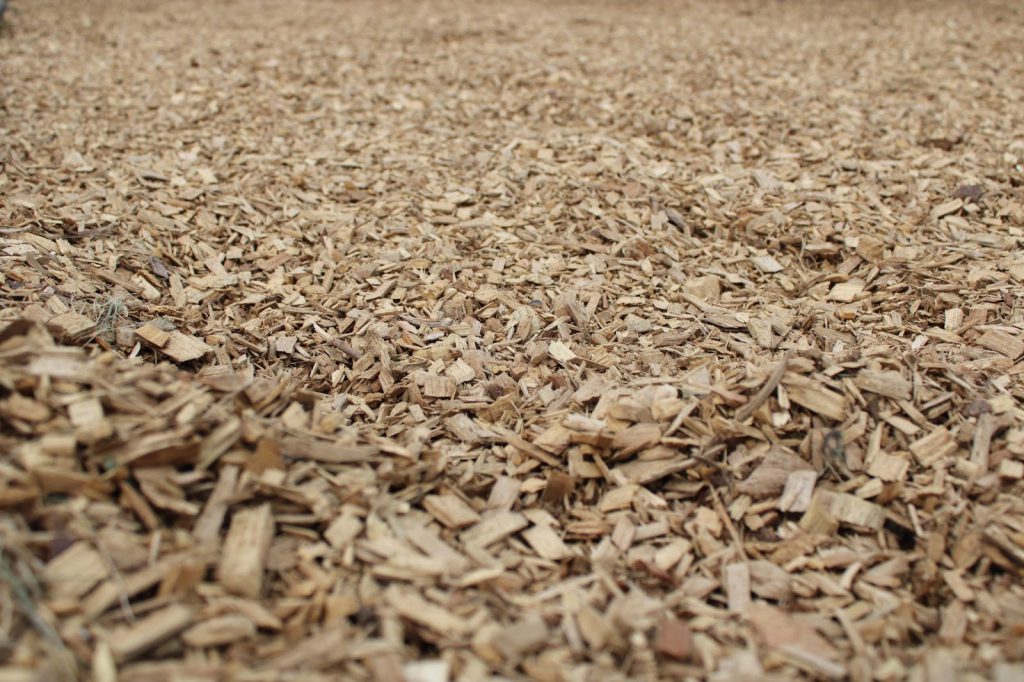A close-up photograph of new mulch at a playground.